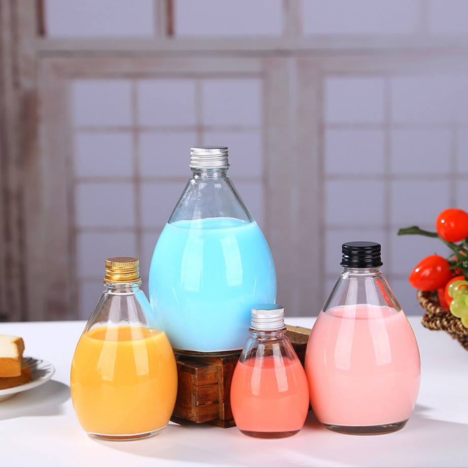 Diseño de gotas de agua Bebidas de jugo Botellas de vidrio Fábrica KDG