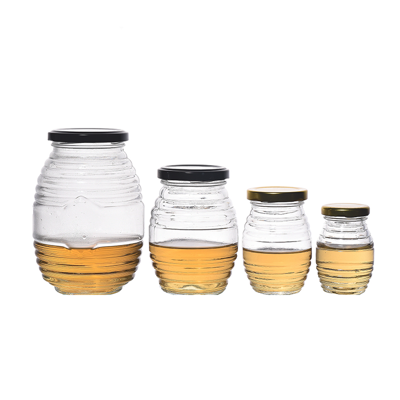 Frascos de miel de vidrio vacío de flint 100ml 250ml 500ml 1000ml Jam Jam Jares Botella en forma de ovalado al por mayor